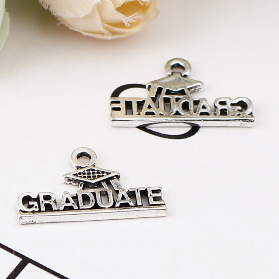Picture of Zinc Based Alloy College Jewelry Charms Antique Silver Color Trencher Cap Message " Graduate " 22mm x 13mm, 20 PCs