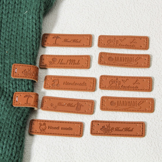 Immagine di 50 Pz PU Etichetta Etichetta per Abbigliamento Rettangolo Marrone " Hand Made " 5cm x 1.5cm