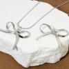 Picture of Eco-friendly Brass Clothes Charms Real Gold Plated Bowknot 3D